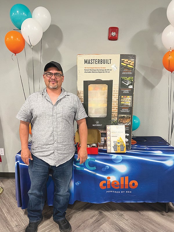 Charles Valdez with Tri-State's door prize, smoker