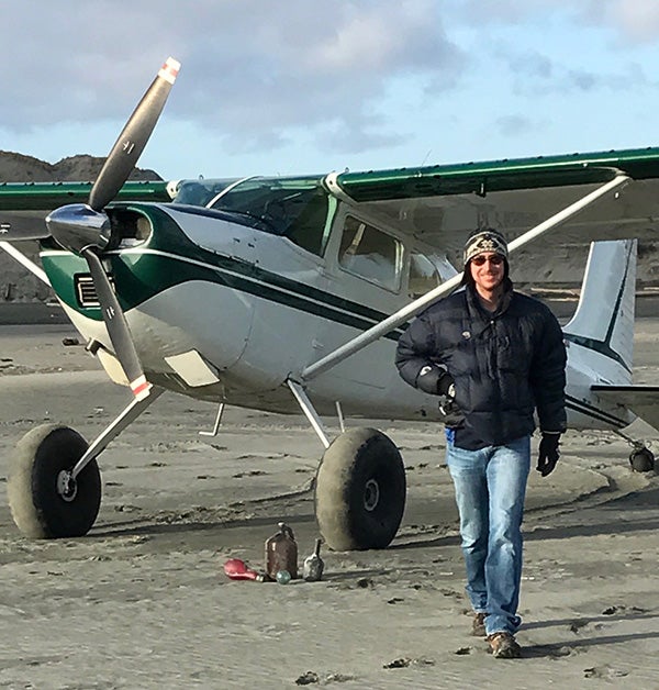new CEO Eric Eriksen standing by an airplane