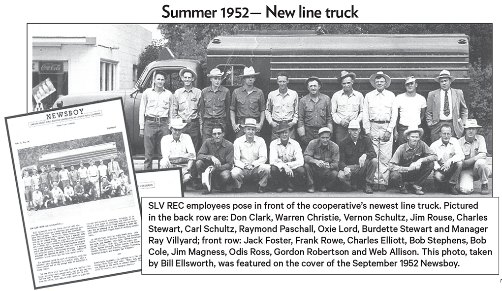 employees pictured with truck