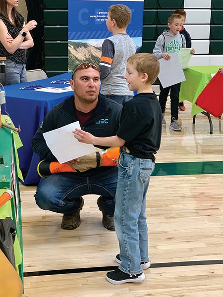 Lineman talking to student